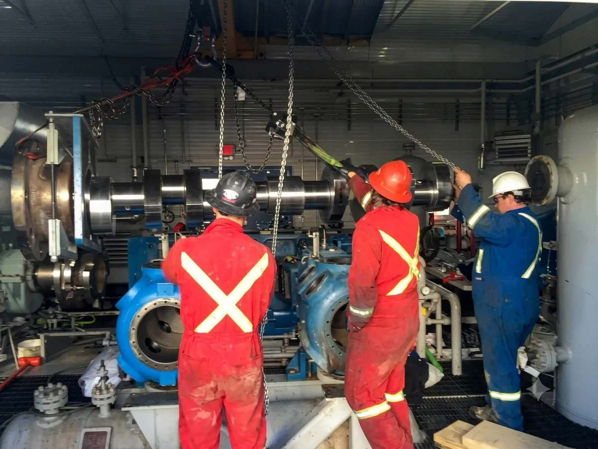 Everflo mechanics working together on a compressor